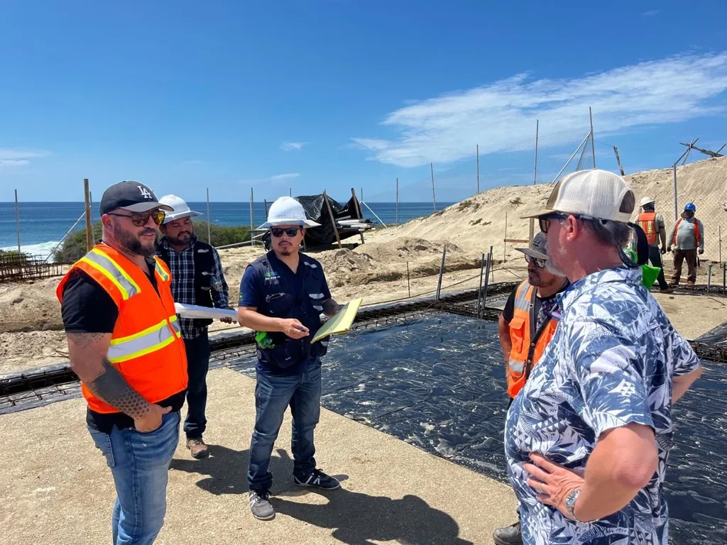 Coordination meeting beside a foundation in progress