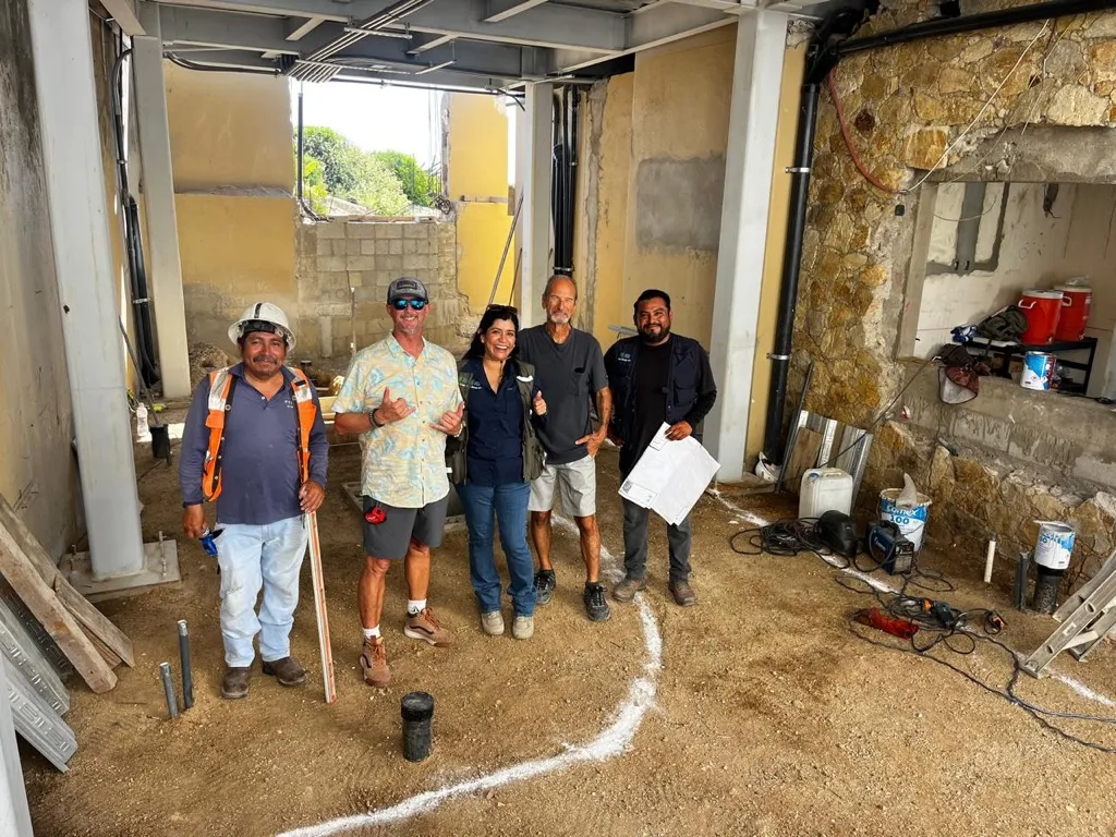 Team and homeowners during a construction site visit